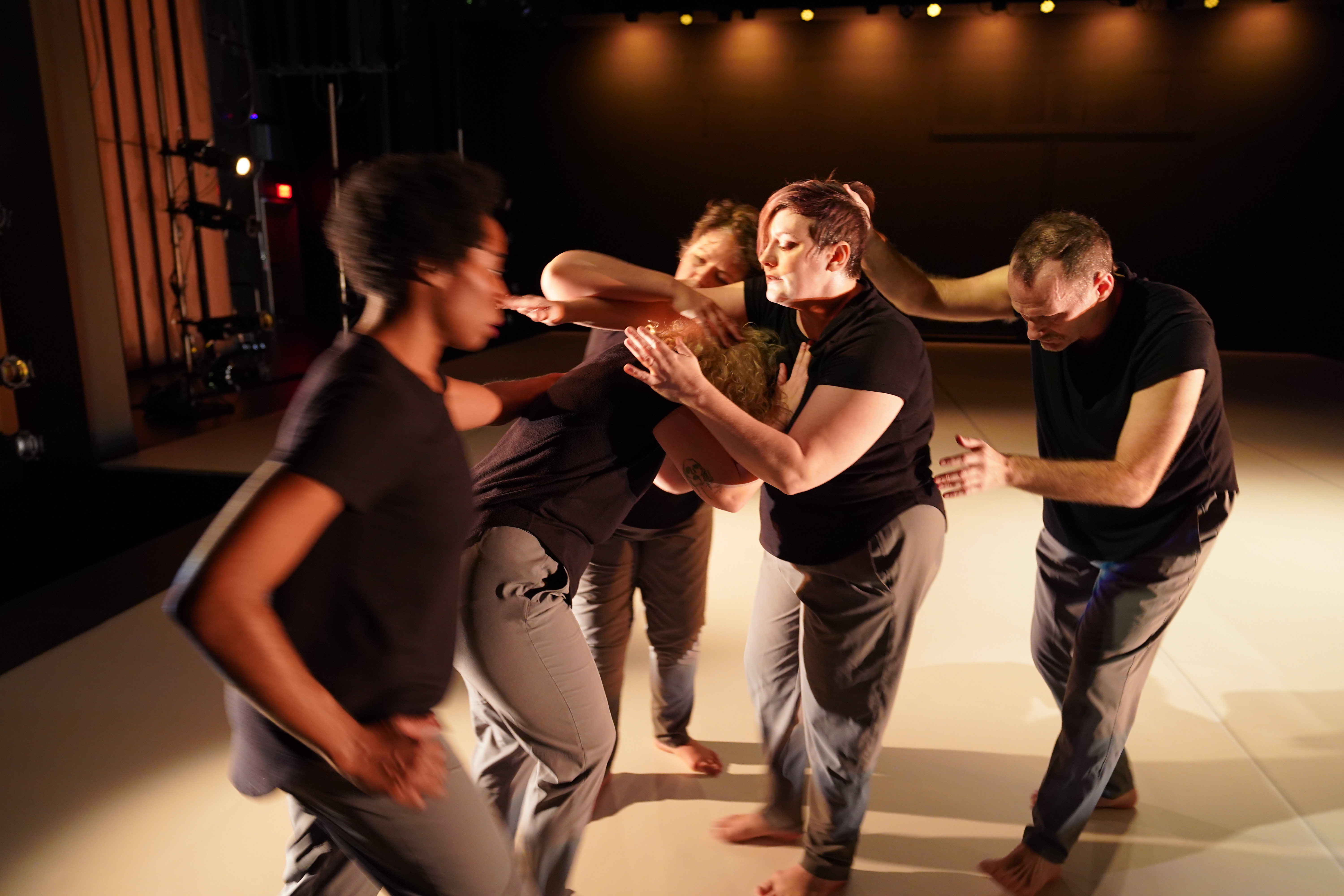 dancers in the midst of a movement exercise